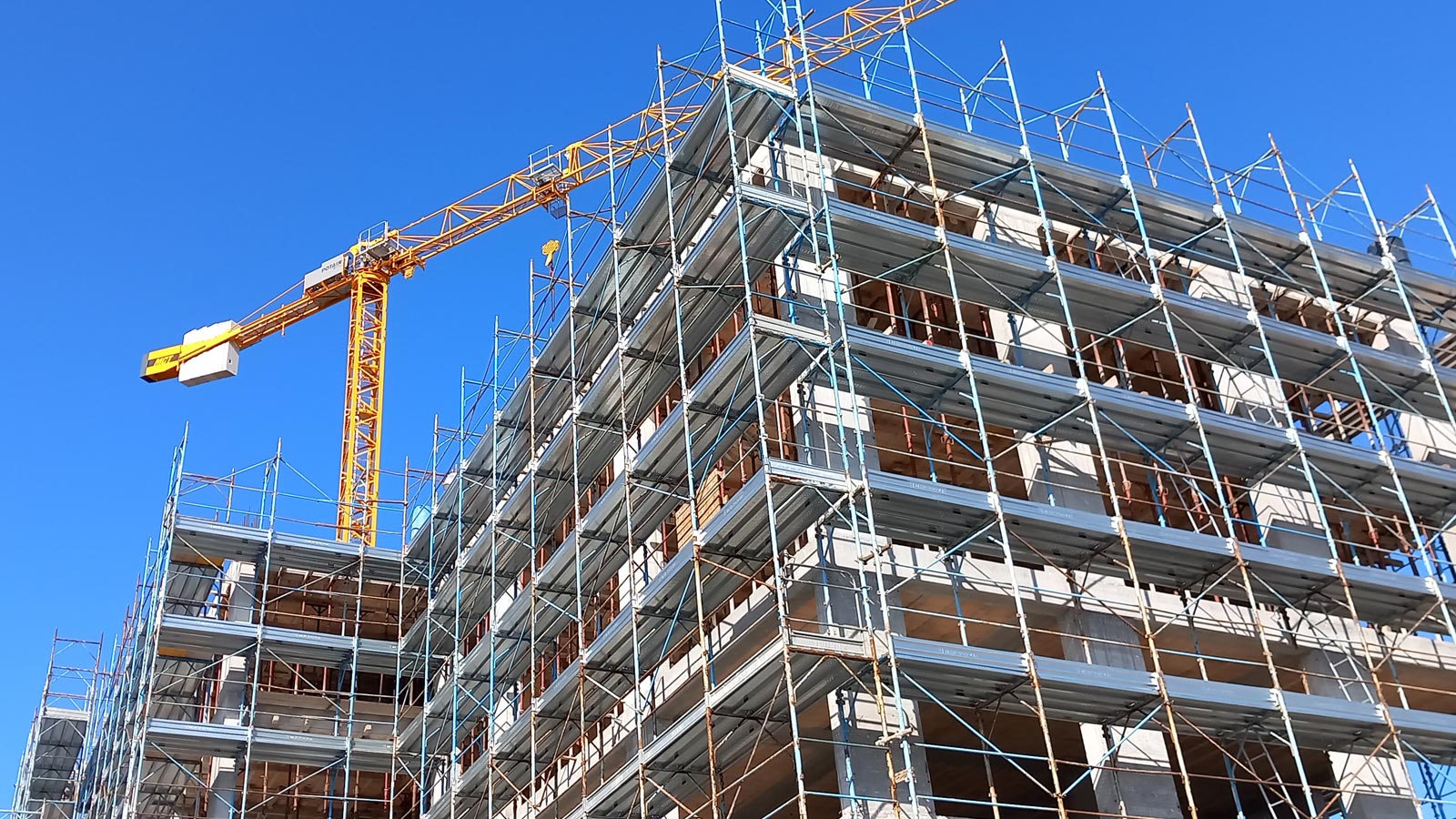 Scaffolding and cranes used in construction sites in Italy